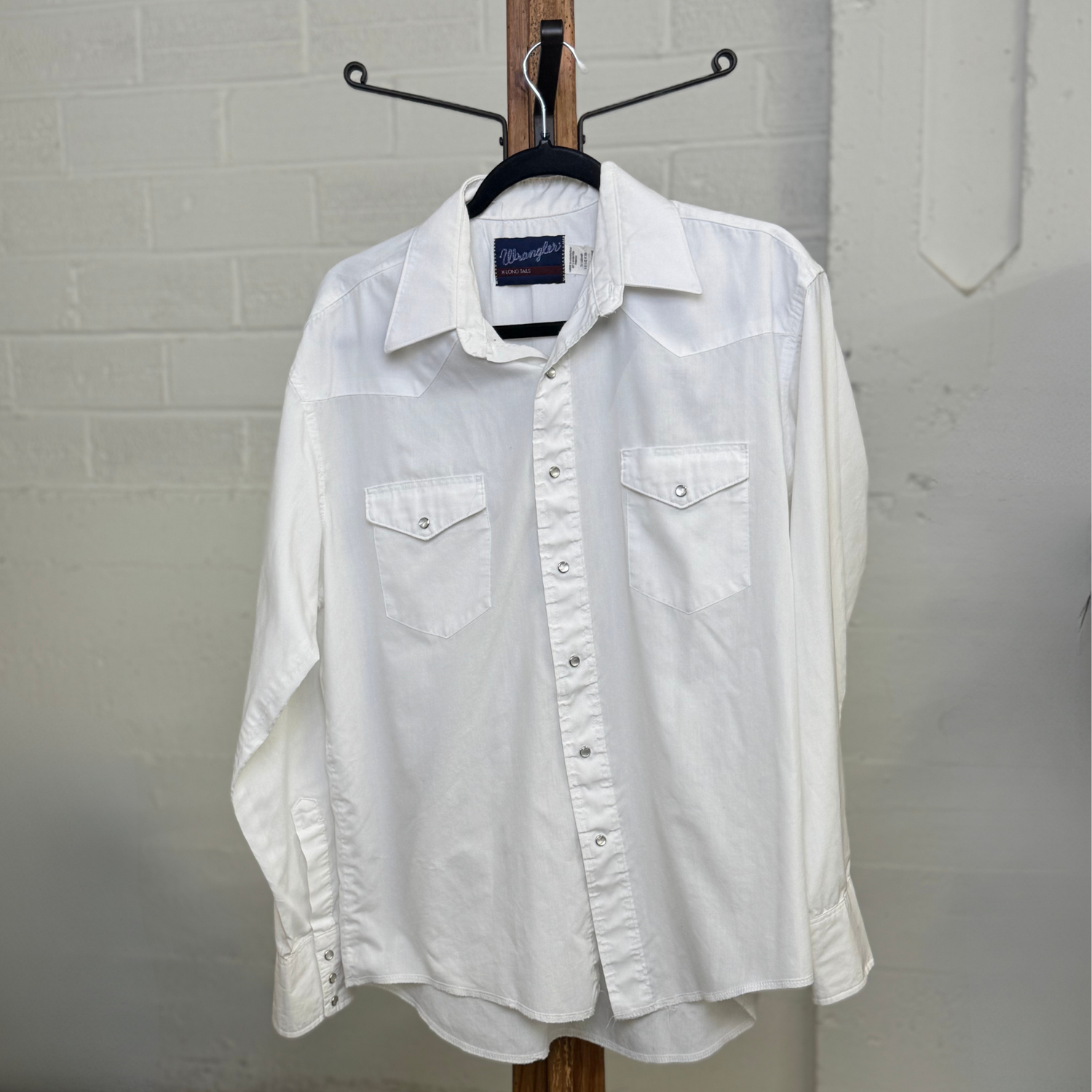 white pearl snap dress shirt Vintage 1990s Wrangler White Pearl Snap Shirt – X-Long Tails Western Button Down